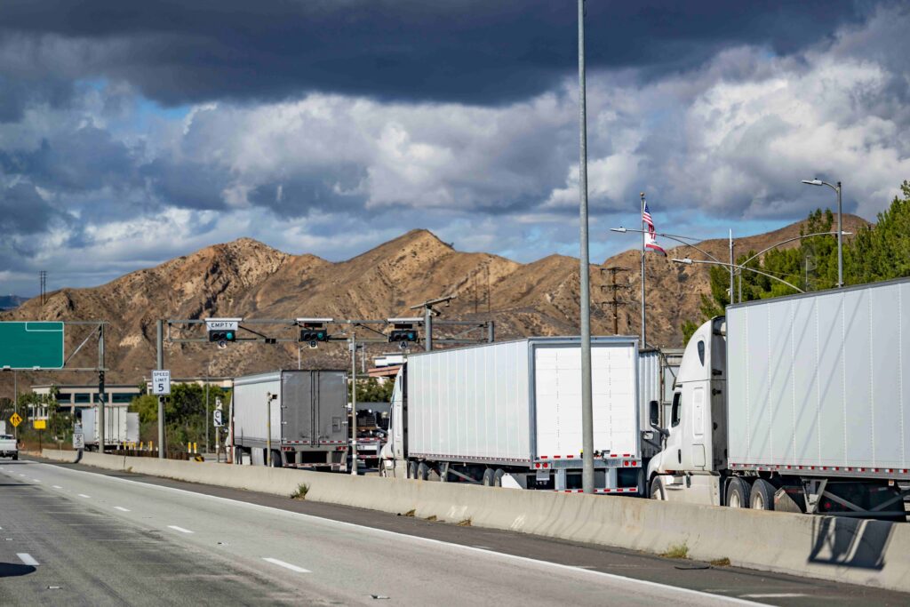 Semi truck stopped on a highway weigh station scale
